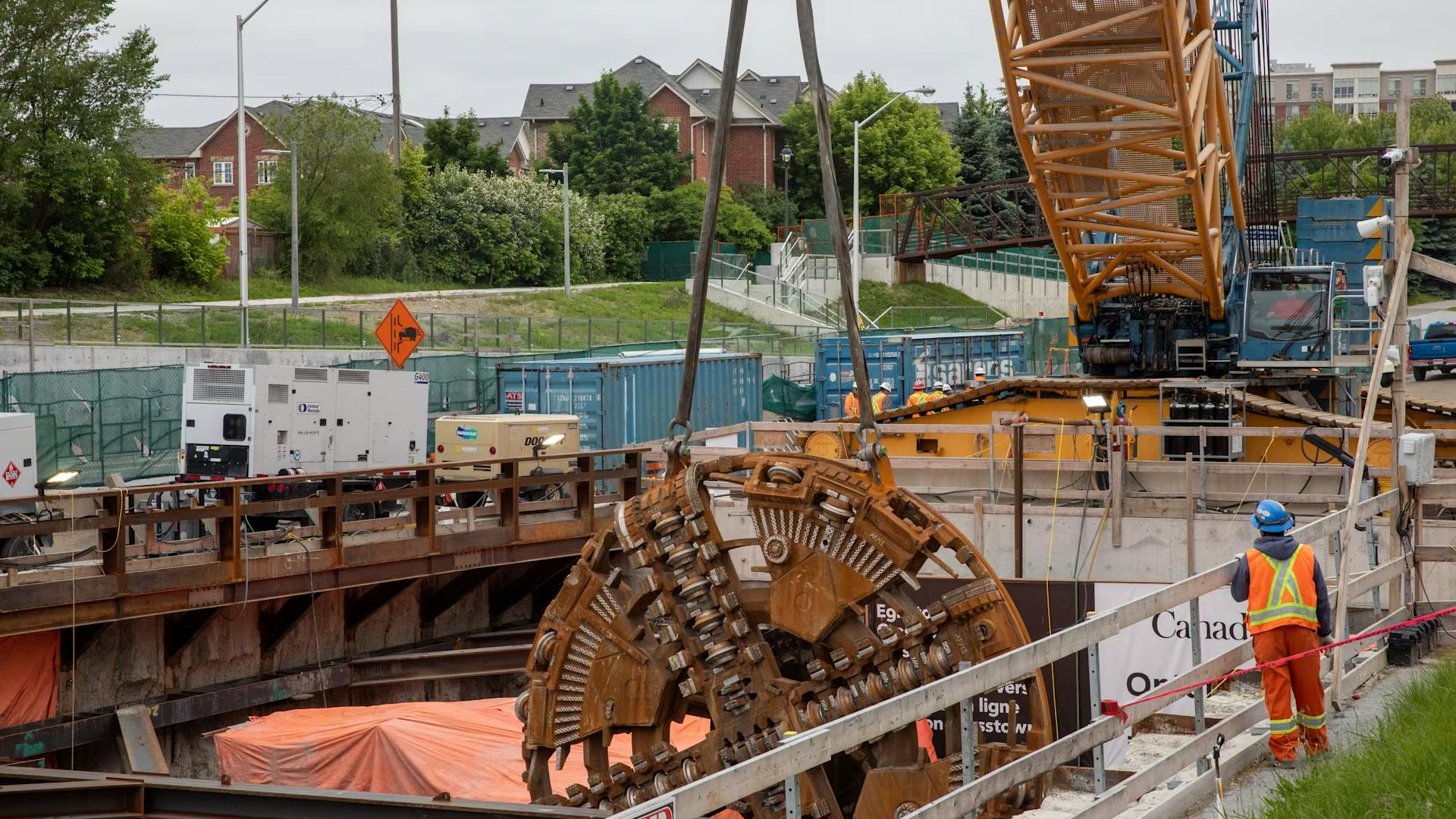 After being disassembled, parts of the TBM are carefully lifted out of the extraction shaft with a crane