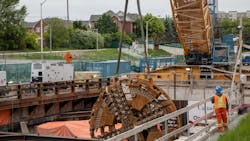 After being disassembled, parts of the TBM are carefully lifted out of the extraction shaft with a crane After being disassembled, parts of the TBM are carefully lifted out of the extraction shaft with a crane