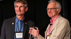 Stuart Grassie (right), principal, Rail Measurement Limited / Stuart Grassie Engineering Limited receives the Worth Award from Wheel Rail Seminars founder Gordon Bachinsky (left).