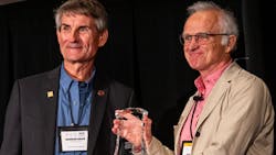 Stuart Grassie (right), principal, Rail Measurement Limited / Stuart Grassie Engineering Limited receives the Worth Award from Wheel Rail Seminars founder Gordon Bachinsky (left). Stuart Grassie (right), principal, Rail Measurement Limited / Stuart Grassie Engineering Limited receives the Worth Award from Wheel Rail Seminars founder Gordon Bachinsky (left).