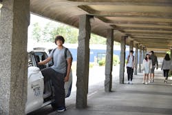 A student at the South Seattle College campus steps aboard a Metro Flex vehicle. A student at the South Seattle College campus steps aboard a Metro Flex vehicle.