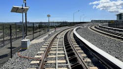 A top of rail friction management system installed on transit track. A top of rail friction management system installed on transit track.