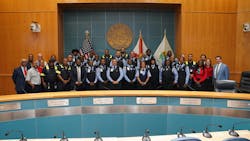 Graduates posing with speakers and training staff. Graduates posing with speakers and training staff.