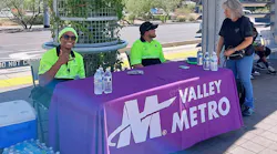 Valley Metro Customer Experience Coordinators hosting a Heat Relief pop-up at a light-rail platform.