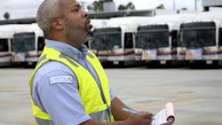 Keolis operator Steven Polite conducts a pre-trip inspection at the OCTA yard in Anaheim, Calif. Keolis operator Steven Polite conducts a pre-trip inspection at the OCTA yard in Anaheim, Calif.