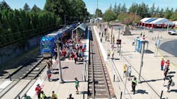 A Better Red official opening ceremony participants at the newly named Hillsboro Airport/Fairgrounds MAX Station prepare for the ceremonial ‘first ride.’ A Better Red official opening ceremony participants at the newly named Hillsboro Airport/Fairgrounds MAX Station prepare for the ceremonial ‘first ride.’
