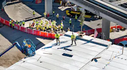 The topping out ceremony signified the last structural beam being raised into place.