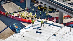 The topping out ceremony signified the last structural beam being raised into place. The topping out ceremony signified the last structural beam being raised into place.