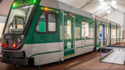 A Type 10 mockup vehicle stood displayed under a tent at City Hall Plaza. A Type 10 mockup vehicle stood displayed under a tent at City Hall Plaza.