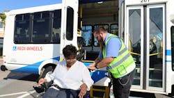 A passenger being let go off of a SamTrans paratransit vehicle. A passenger being let go off of a SamTrans paratransit vehicle.