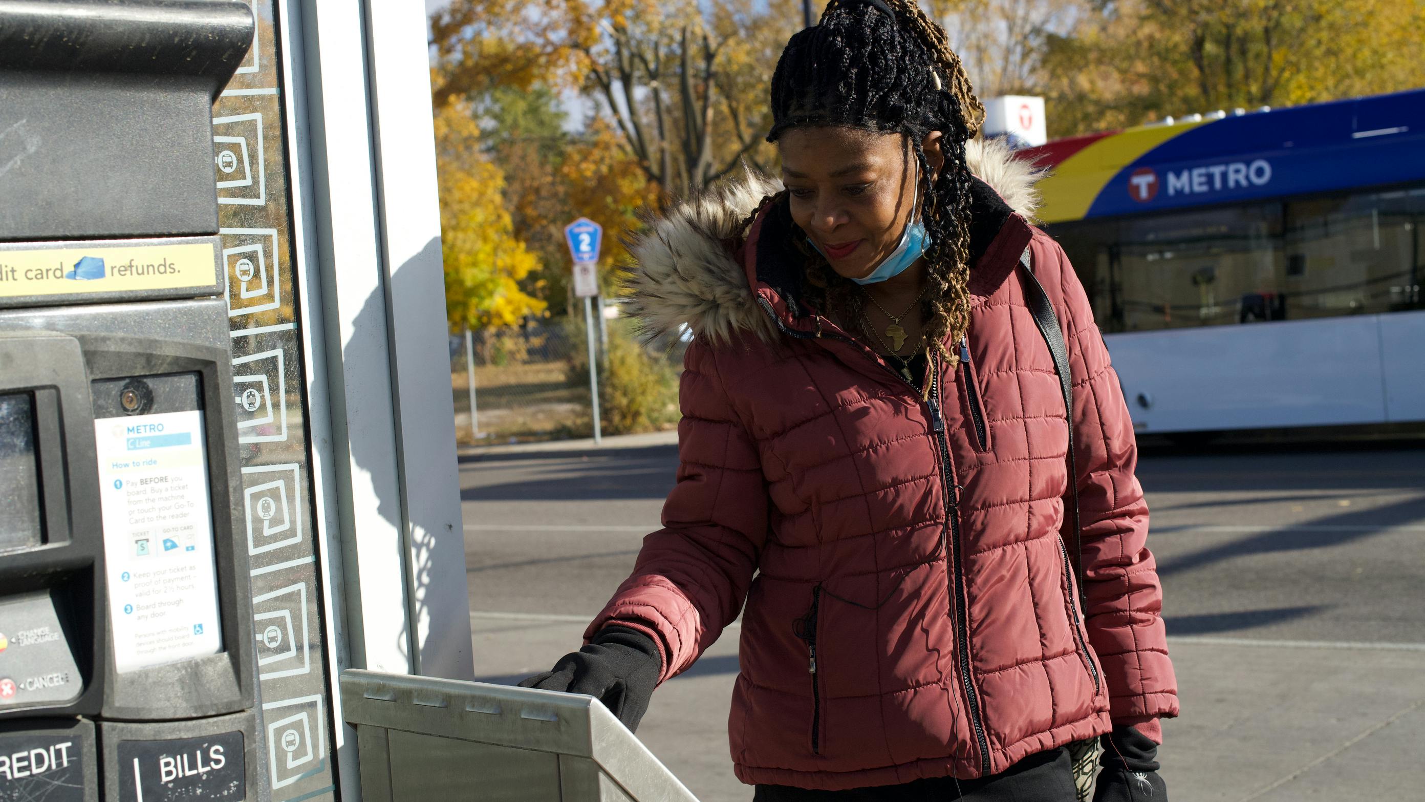 A rider tapping her card on a Metro Transit bus in Minneapolis.