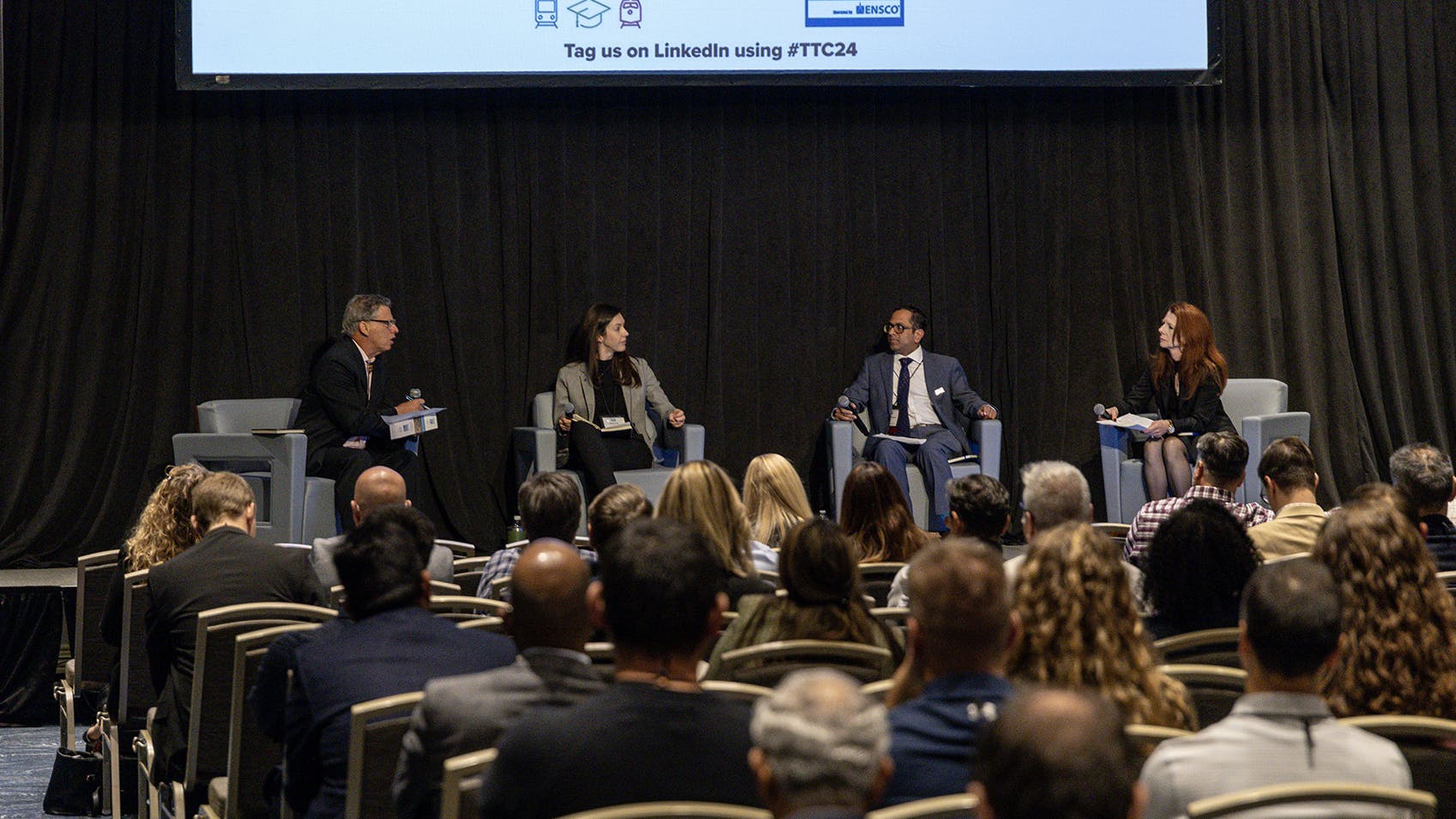 Overview of the guest panel at the 2024 TTC Conference and Tour discussing rail transit research needs. Panelist left-to-right: Ruben Pena (ENSCO Moderator), Molly King (FTA), Narayana Sundaram (WMATA) and Lisa Staes (Center for Urban Transportation Research &ndash; CUTR).