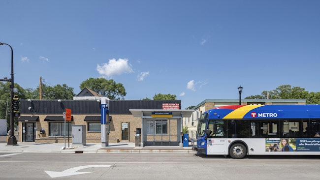 METRO D line BRT stops at a bus shelter