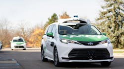 a may mobility sedan drives down road in Ann Arbor with no driver a may mobility sedan drives down road in Ann Arbor with no driver