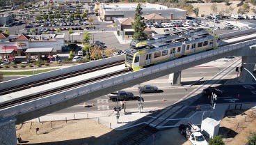Light rail trains traveling over new Lone Hill Ave light rail bridge in Glendora