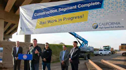 California Governor Newsom makes announcement at podium with project banner in the background