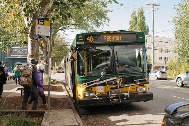 People board a Route 40 bus.