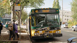 People board a Route 40 bus.