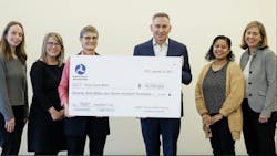 FTA Region 10 Administrator poses with king county executive holding big check FTA Region 10 Administrator poses with king county executive holding big check