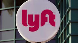 lyft logo on white circle sign outside lyft logo on white circle sign outside