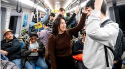 Riders on a BART train. Riders on a BART train.