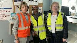 Laura hendricks poses with frontline worker and susan sweat in safety vests Laura hendricks poses with frontline worker and susan sweat in safety vests