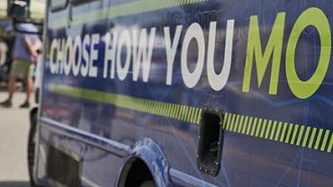 Choose How You Move sign on a WeGp bus.