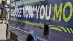 Choose How You Move sign on a WeGp bus. Choose How You Move sign on a WeGp bus.