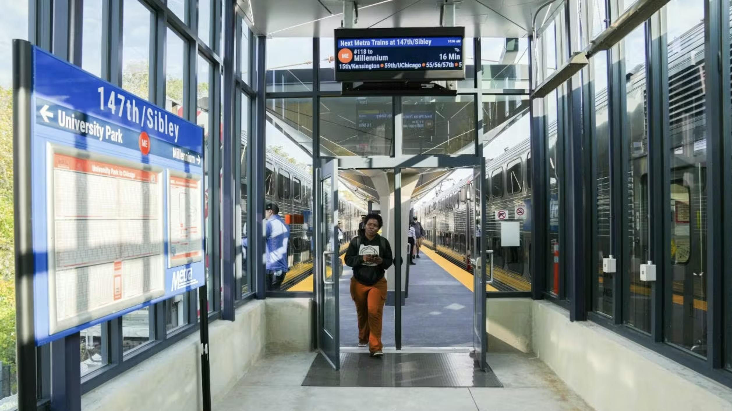 person walks into rehabbed 147/Sibley metra station