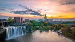 picture of Rochester NY's skyline at sunset with water fall
