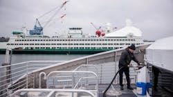 Water taxi crew member fuels the Doc Maynard. Water taxi crew member fuels the Doc Maynard.