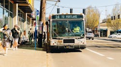 A TriMet bus at a bus stop. A TriMet bus at a bus stop.