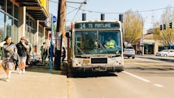 A TriMet bus at a bus stop. A TriMet bus at a bus stop.
