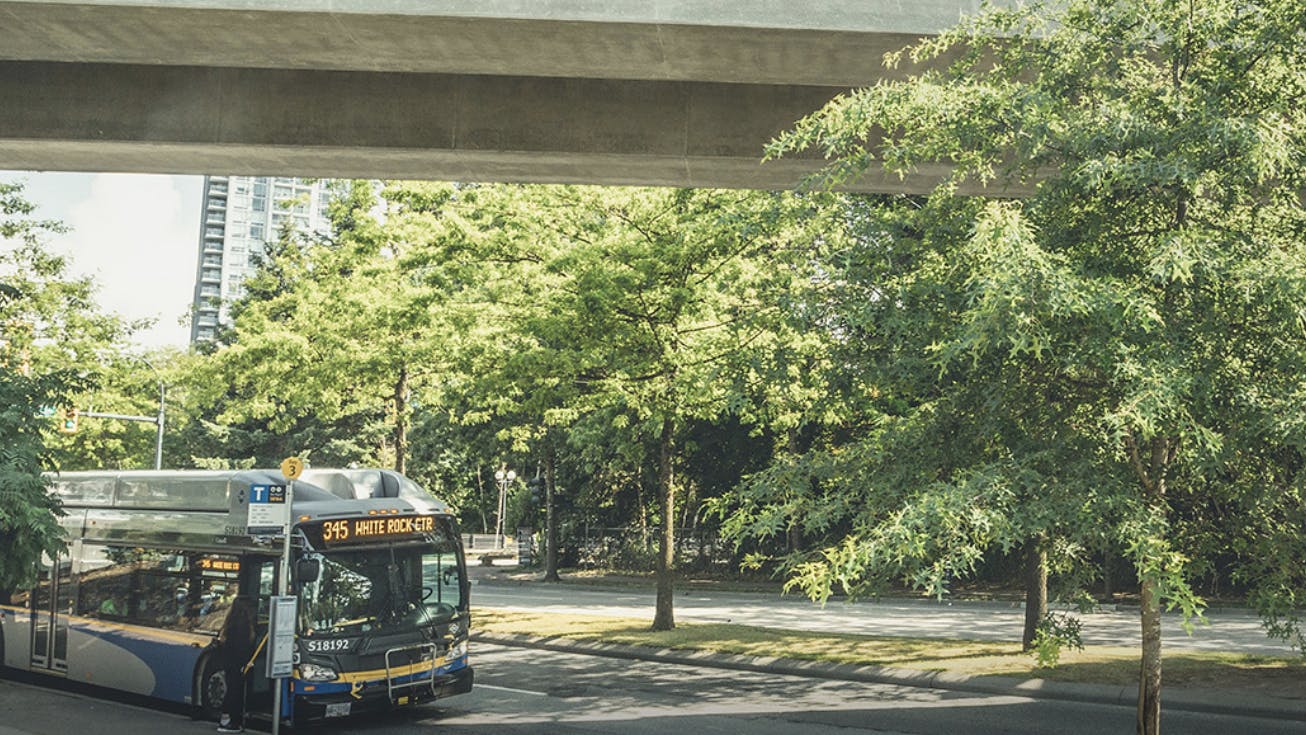TransLink bus pulls up to bus stop