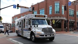 WCT cutaway bus travels down a street WCT cutaway bus travels down a street