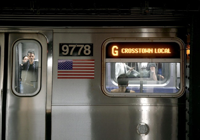 people ride in new york city transit subway G crosstown train
