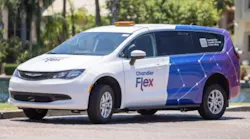 chandler flex-branded mini van parks next to a street curb