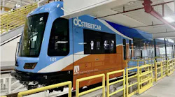 new oc streetcar-branded light-rail train sits in the depot