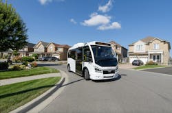 Karsan eJEST minibus drives through a neighborhood street Karsan eJEST minibus drives through a neighborhood street