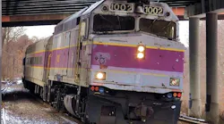 MBTA commuter rail car runs down the track