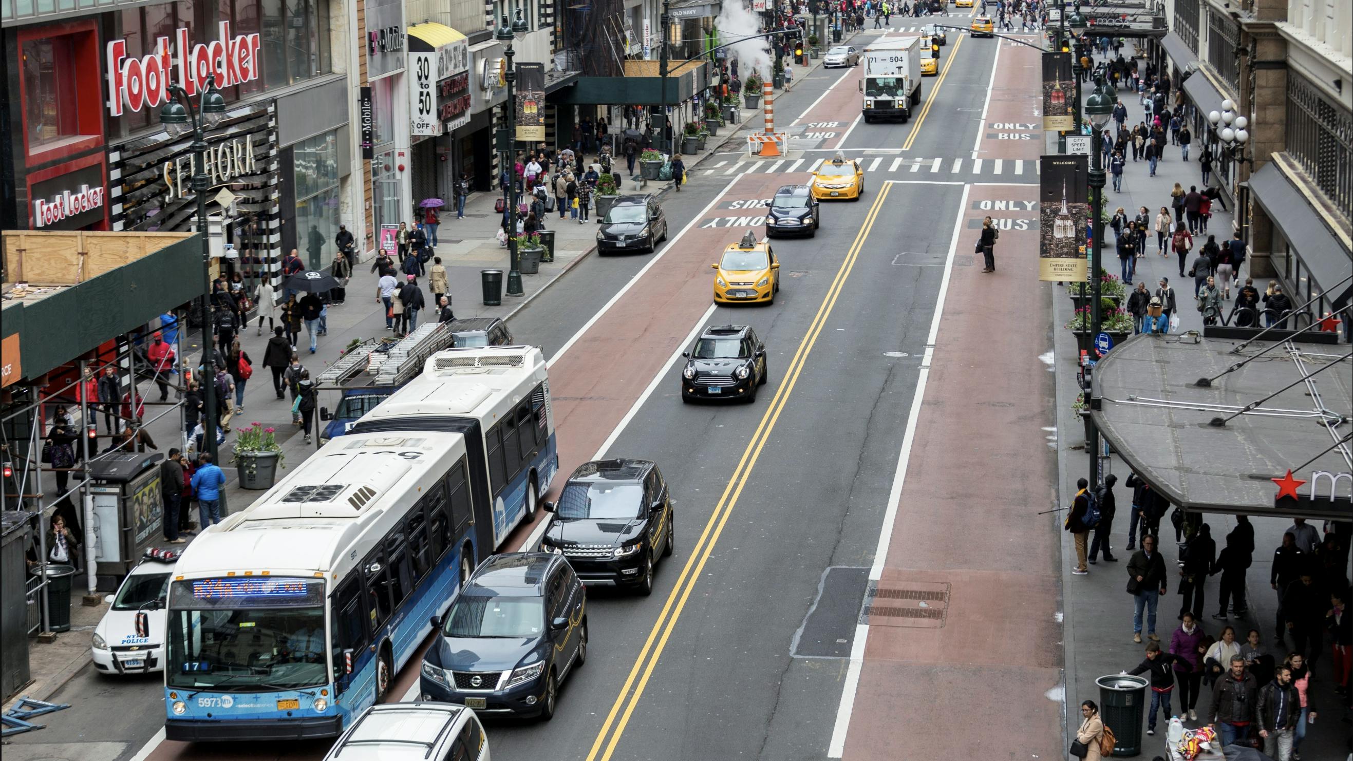 MTA select bus service bus drives down 34th street in a bus lane