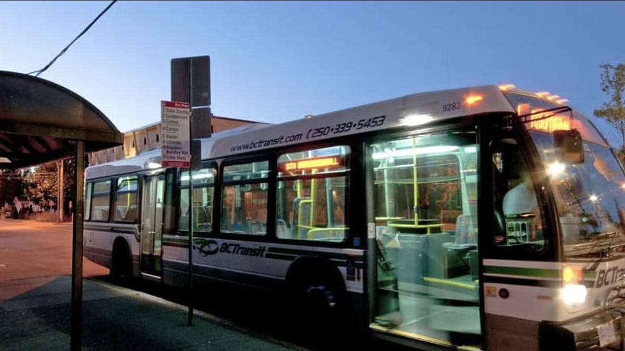 CVRD bus pulls up to bus stop at a curb
