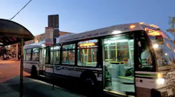 CVRD bus pulls up to bus stop at a curb