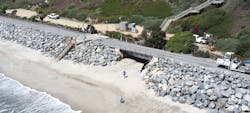 rail tracks running through san clemente near the beach showing large boulders placed along the edige rail tracks running through san clemente near the beach showing large boulders placed along the edige