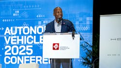 JTA CEO Nat Ford stands at a podium with the JTA logo on the front and a screen behind him that says autonomous vehicle 2025 conference JTA CEO Nat Ford stands at a podium with the JTA logo on the front and a screen behind him that says autonomous vehicle 2025 conference