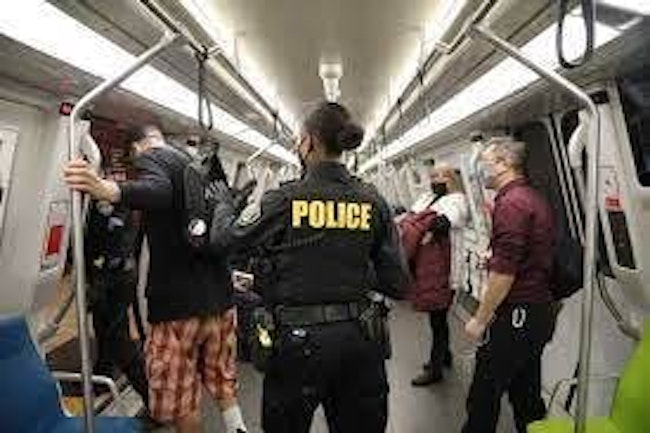 BART police officer on a BART train.