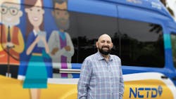 Nicholas A. Sofoul, AICP. next to a NCTD vehicle. Nicholas A. Sofoul, AICP. next to a NCTD vehicle.