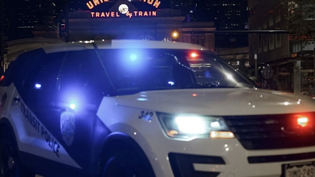 Denver RTD transit police SUV parks outside Denver Union Station at night