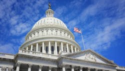 U.S. Capitol Building with a blue sky in the background U.S. Capitol Building with a blue sky in the background