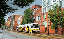 MDOT MTA light rail runs down empty street MDOT MTA light rail runs down empty street